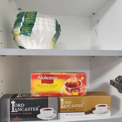 two shelves with food and cups of coffee on them at Cozy Hideaway in Thorold