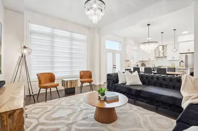 a living room with a couch and a table at Luxury Vacation Home Near Lake Pool Table in Barrie
