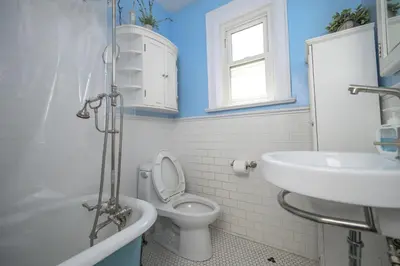a bathroom with a toilet and a sink at Bright and Quiet Bedroom near Subway, Koreatown and UofT in Toronto
