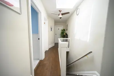 a hallway with white walls and a ceiling at Bright and Quiet Bedroom near Subway, Koreatown and UofT in Toronto