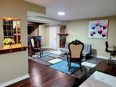 a living room with chairs and a table at Charm Heaven - Workspace, Wi-Fi, 3-Beds and Private Entrance in Pickering