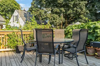 a patio table and chairs on a deck at Heritage 3BR Etobicoke Gem, Sherway Gardens, BBQ in Toronto