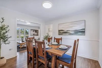 a dining room with a table and chairs at Heritage 3BR Etobicoke Gem, Sherway Gardens, BBQ in Toronto