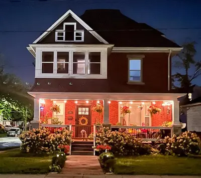 a house with christmas lights on the front of it at The Lakeview Loft in Port Colborne