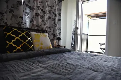 a bedroom with a bed with a large window at Have whole house to yourself in Thorold