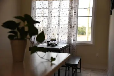 a dining room with a table and a window at Have whole house to yourself in Thorold