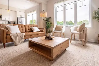 a living room with a couch and a coffee table at Spotless 4 bed and 3 bath with Wi-Fi and 1hr to Niagara in Hamilton