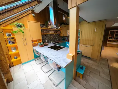 an overhead view of a kitchen with a island at Riverside Retreat with Sauna & Hot Tub in Elora in Elora