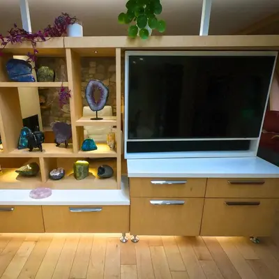 a large flat screen television in a room with shelves at Riverside Retreat with Sauna & Hot Tub in Elora in Elora