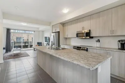 a kitchen with a sink and a counter top at A Brand New 4BR Townhouse in Thorold Retreat in Thorold