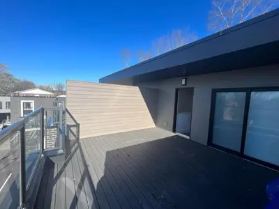 a balcony of a house with a wooden deck at 2 Bed Town ideal for a fun-filled family vacation in Niagara Falls