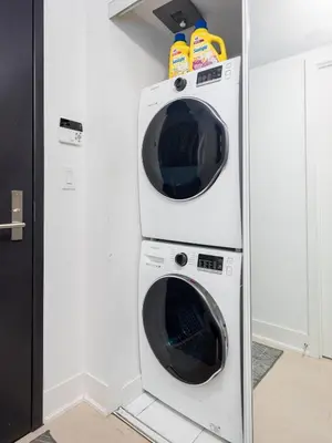 two washer and dryer in a refrigerator at Modern Micro Studio in Heart of Downtown in Toronto