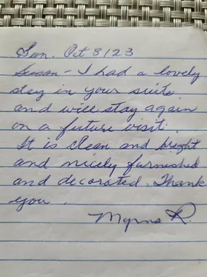 a handwritten letter in blue handwriting on at Cozy and comfy Studio Apartment in Richmond Hill