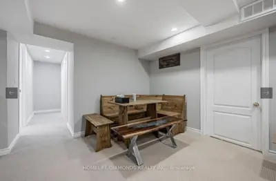 a room with a wooden table and a bench at Rare 3 Bedroom Luxury Close to Lake in Oakville