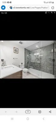 a bathroom with a tub and a sink and a toilet at Rare 3 Bedroom Luxury Close to Lake in Oakville