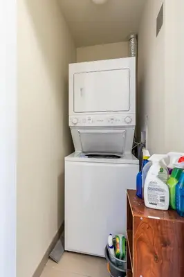 a microwave oven sitting on top of a refrigerator at Modern Suite w City Views - Downtown in Toronto