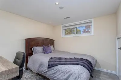 a bedroom with a bed and a window at Bright & Modern 1 bedroom unit! in Guelph
