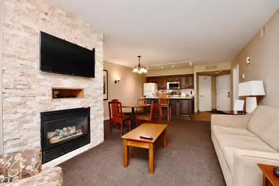 a living room with a couch and a fireplace at Relaxing 2BR Retreat at Carriage Hills in Edgar