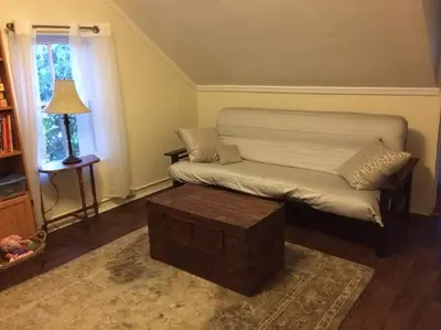 a living room with a couch and a coffee table at Charming Farmhouse in the City, Near Wine Country in Belleville