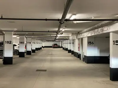 an empty parking garage with cars parked in it at Beautiful Condo, 2 Bedrooms and a Den in Friday Harbour Resort! in Innisfil
