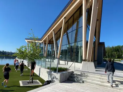 a group of people walking outside of a building at Beautiful Condo, 2 Bedrooms and a Den in Friday Harbour Resort! in Innisfil