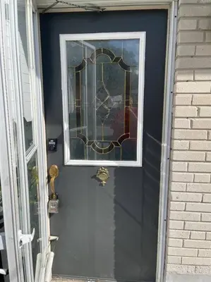 a blue door with a window on it at Quaint and Cozy Haven in Toronto