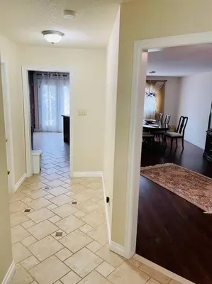 an empty living room with a dining room and a dining table at Three bedroom house in Mississauga
