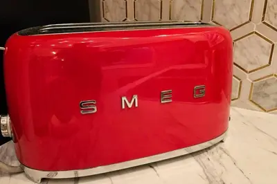 a red suitcase sitting on top of a counter at Luxury Family House 3 beds, 1 bath, 5 guest in Toronto