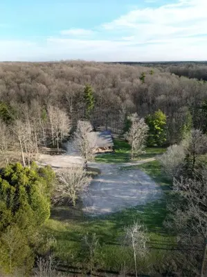 an aerial view of a house in the middle of a forest at Forest Hideaway in Hespeler