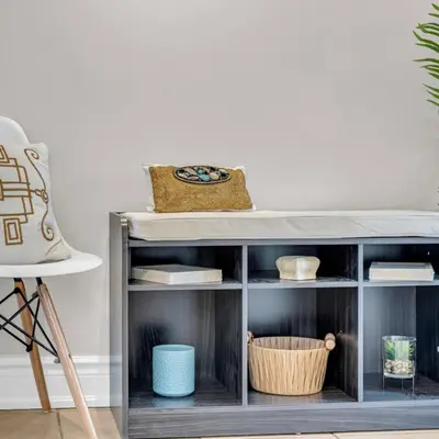 a shelf with bowls and other items on it at Retro Arcade & Gaming Home by Pako Stays in Brampton