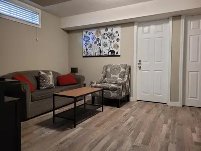 a living room with a couch and a table at Boardwalk Homes - Executive Townhomes in Kitchener