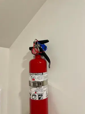 a red fire hydrant with keys on top of it at New Cosy bright and Spacious Apartment in East Gwillimbury