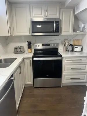 a kitchen with a black oven and a microwave at Cozy Home away in Ajax 2 BR 1 bath 4 guests in Ajax