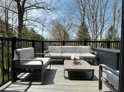 a patio with two couches and a coffee table at BRAND-NEW LUXURY SUITE in DOON SOUTH, min to 401 in Kitchener