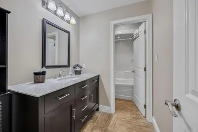 a bathroom with a sink and a mirror at LUX Lakefront Sleeps18 Pickleball HotTub Sauna Gym Arcade Basketball Volleyball in Buckhorn