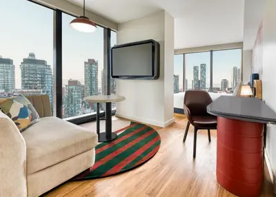 a living room with a couch and a tv at Toor Hotel Toronto, Part Of Jdv By Hyatt in Toronto