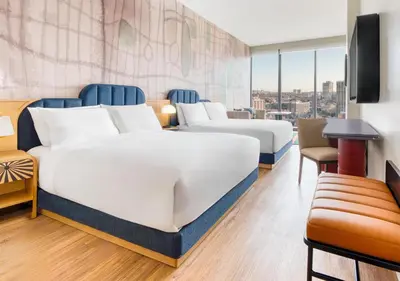 a hotel room with two beds and a tv at Toor Hotel Toronto, Part Of Jdv By Hyatt in Toronto