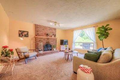 a living room with a couch and a fireplace at 45 per Off Monthly Stay - 7 Beds - BBQ in Kitchener