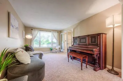 a living room with a piano and a couch at 45 per Off Monthly Stay - 7 Beds - BBQ in Kitchener