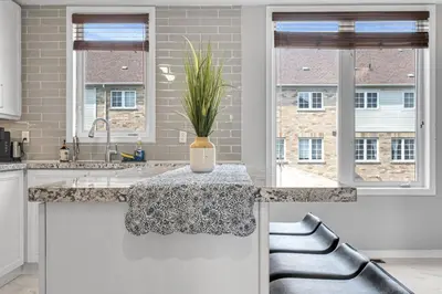 a kitchen with a counter with a plant on it at Elegant 3Bedroom with Smart TV and Backyard in Mississauga