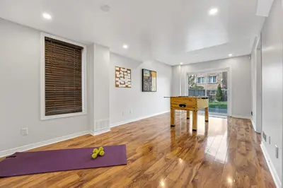 an empty room with a table and yoga mats at Elegant 3Bedroom with Smart TV and Backyard in Mississauga