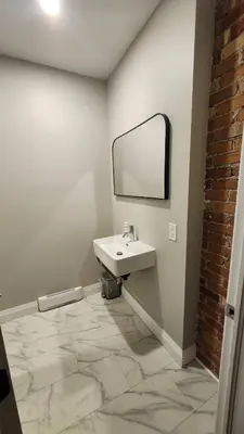 a bathroom with a sink and a mirror at ENTIRE BACHELOR UNIT EN-SUITE ACROSS FROM GOOGLE - br4 in Kitchener