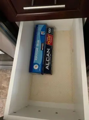 a shelf with two books in a drawer at Huge Family home sleeps 10 with 3 parking spots in Kitchener