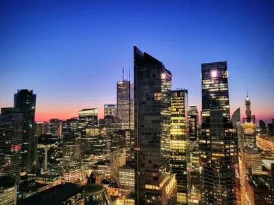 a view of a city skyline at night at View CN Tower and Lake from the Sky! in Toronto
