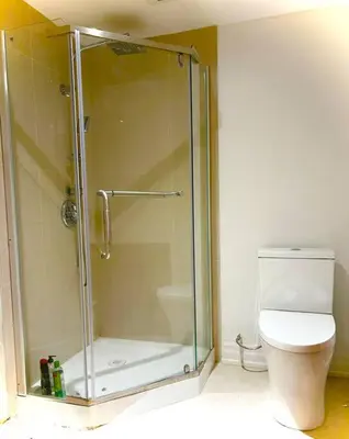 a shower stall in a bathroom with a toilet at Central Toronto in Toronto