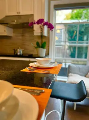 a kitchen with a table with a bowl on top of it at Central Toronto in Toronto