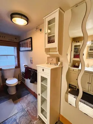 a bathroom with a toilet and a sink at The Cozy Corner in Elora