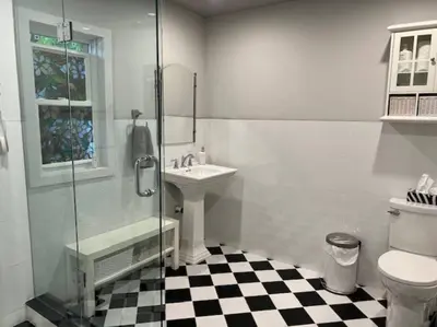 a bathroom with a toilet and a sink and a shower at Luxury and comfy Home- Niagara getaway in Niagara Falls