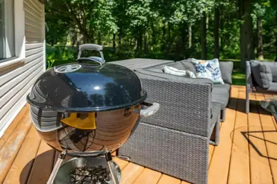 a bird grill sitting on top of a deck at Carson's Creek in Hillier