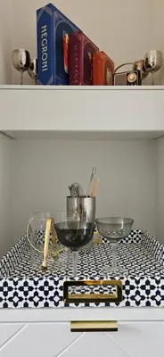 a table with two glasses of wine and a book at Cozy 3BR Retreat with Dedicated Work table and Parking in Toronto